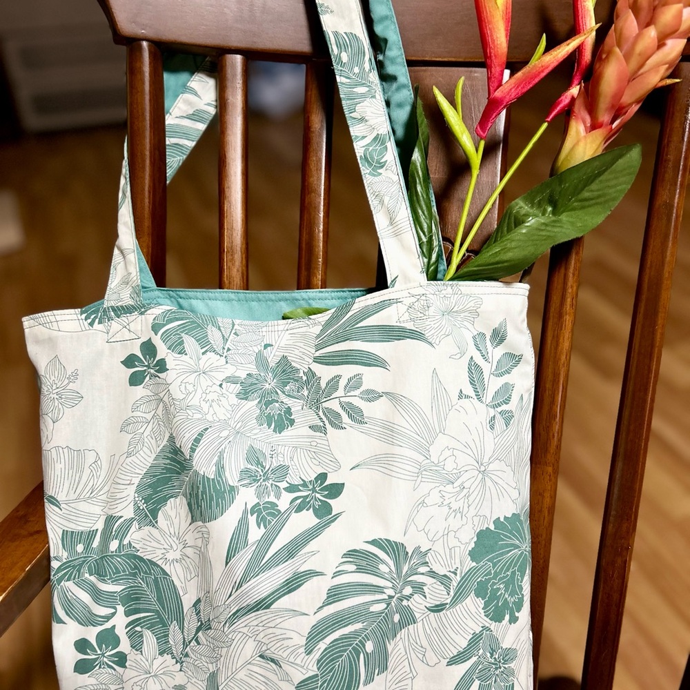 Reversible tote bags crafted with love by a Thai volunteer community.